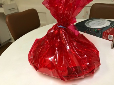DIY Gift Baskets - pull cellophane up and secure with a rubber band