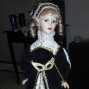 Identifying a Porcelain Doll - doll in elegant black and white gown with matching hat