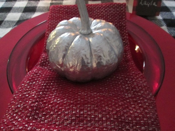 Transforming Gourds Into Elegant Decor - silver gourd on a red plate