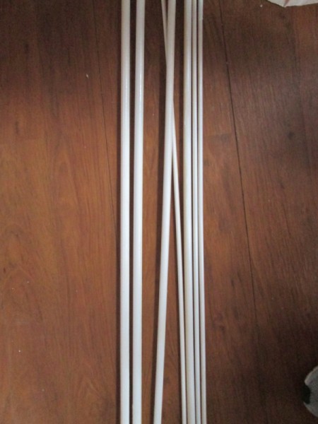 Rods for hanging wrapping paper.