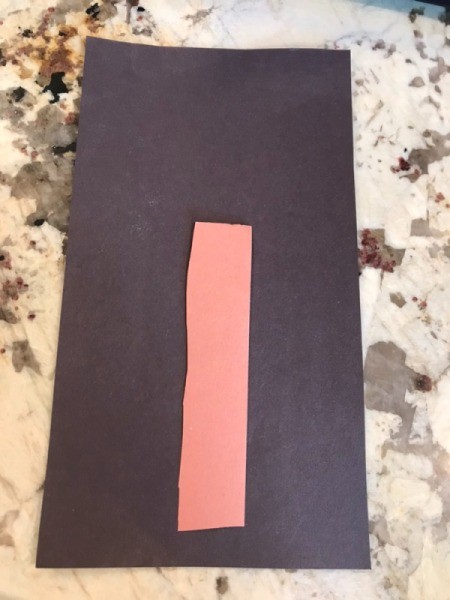 Christmas Tree Card Made by a Toddler - glue down the trunk