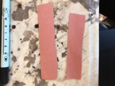 Christmas Tree Card Made by a Toddler - trunks cut from brown paper