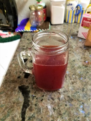 A glass of iced tea flavored with sugar free gelatin.