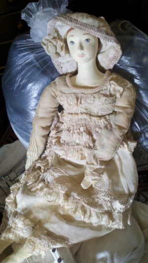 Identifying a Porcelain Doll - old style doll wearing a hat and matching long dress with lace