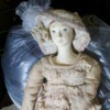 Identifying a Porcelain Doll - old style doll wearing a hat and matching long dress with lace
