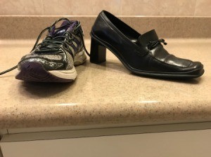 A sneaker next to a heeled dress shoe.