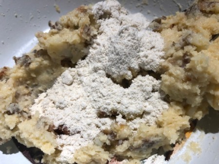 adding flour to mixed ingredients