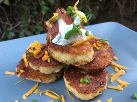 Potato Patties with sour cream cheese & chives on plate