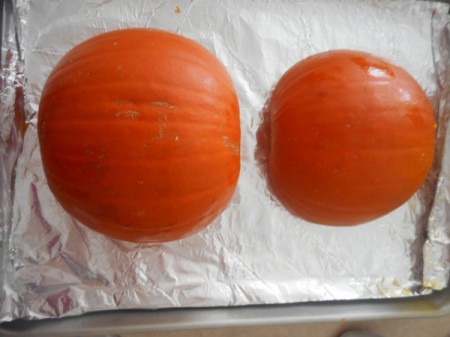 Pie Pumpkin halves upside down on tray