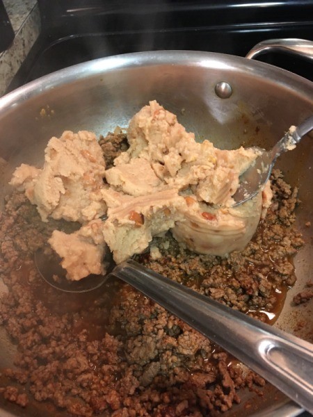 mixing beans with meat