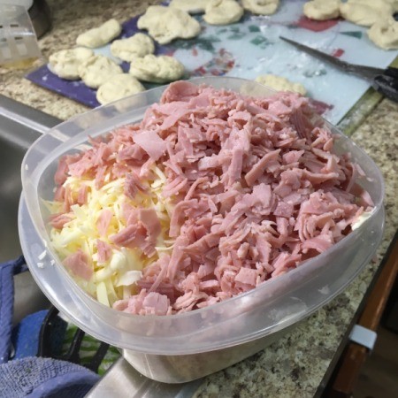 mixing cut Ham and grated  Cheese