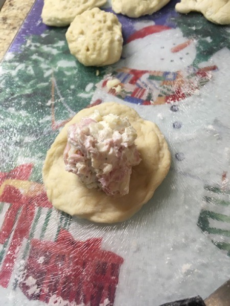 adding filling to dough circle