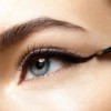 closeup of person applying eyeliner
