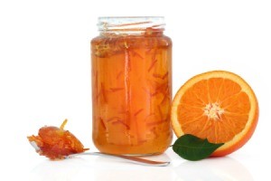 jar of marmalade and orange half