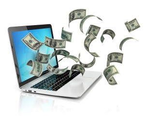 money flying around about a laptop
