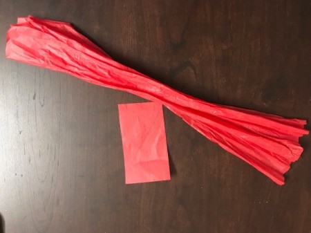 Snowflake Bow for Oversize Gift - cut out a long and a short rectangle of tissue paper, gather the longer one