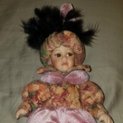 Identifying a Porcelain Doll - doll wearing a turban with feathers
