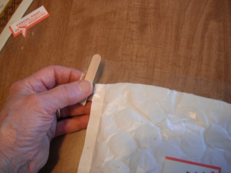 Securing the End of Packaging Tape - Popsicle stick on length of tape