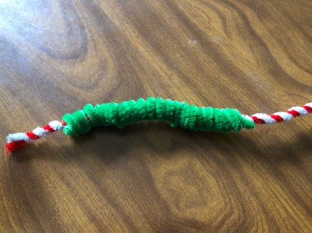 Mini Christmas Wreath - slide the red/white twisted pipecleaners through the green ones