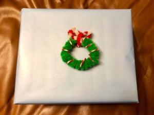 Mini Christmas Wreath - wreath on a wrapped gift