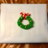 Mini Christmas Wreath - wreath on a wrapped gift