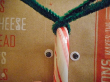 Reindeer Candy Cane - place crook of the cane in the V and cross the pipe cleaners over once