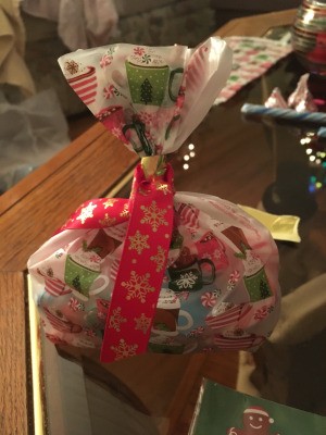 A goodie bag with candy and other items.