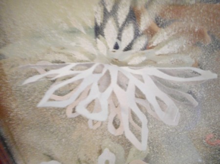 Snowy Window or Mirror - gently remove the paper flakes and any tape, wipe up and fake snow on furniture or flooring