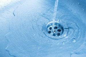 Water going down a sink drain.