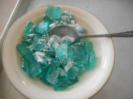 adding powdered sugar to Hard Tack Candy