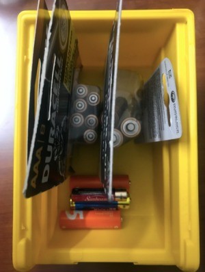A collection of batteries in a container.
