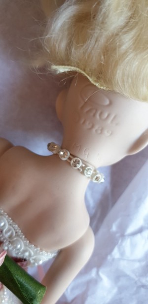 Identifying the Initials JMG on a Doll's Head
