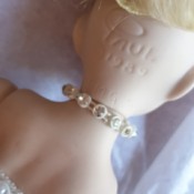 Identifying the Initials JMG on a Doll's Head