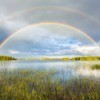 Double rainbow over a lake.