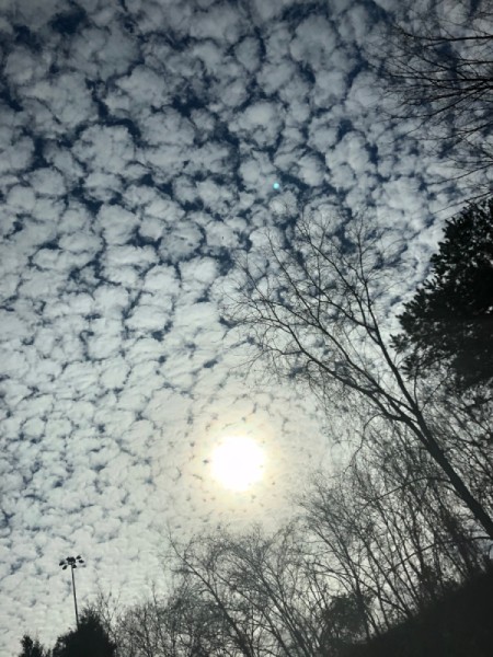 Clouds in the sky that resemble snow.