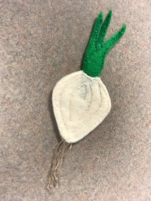 A felt shallot ornament.