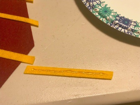 Felt Clip-on Harry Potter Ties - hot glue on the back of a wide yellow felt strip