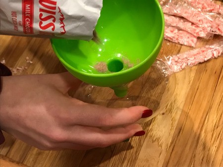 Hot Cocoa Ornaments - pour cocoa into the ornament using a funnel