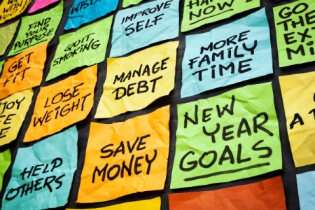 A wall of sticky notes with New Year resolutions.