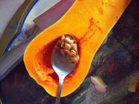 scooping Butternut Squash seeds