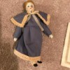 Identifying Porcelain Dolls - doll wearing long dress edged with lace, with matching cape