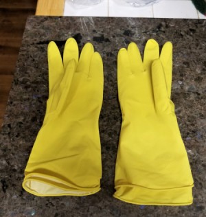 A pair of yellow kitchen gloves, doubled up.