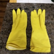 A pair of yellow kitchen gloves, doubled up.