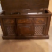 The wooden cabinet of a vintage stereo system