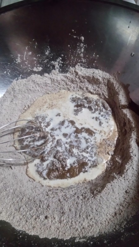 adding milk and egg to dry ingredients