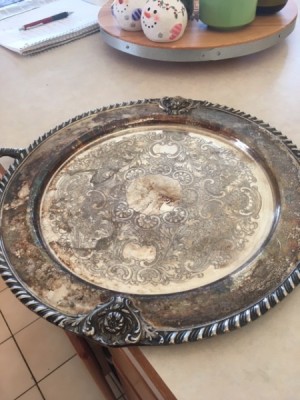 Finding the Value of a Silver Platter - tarnished round ornate silver platter