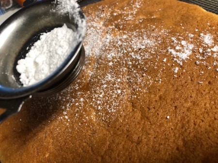 sifted powdered sugar on cake