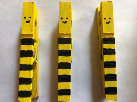 "Bee Mine" Clothespin Craft - smiley faces painted on the top portion