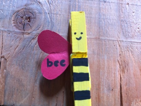 "Bee Mine" Clothespin Craft - pinch the pin open and attach the wing behind the face