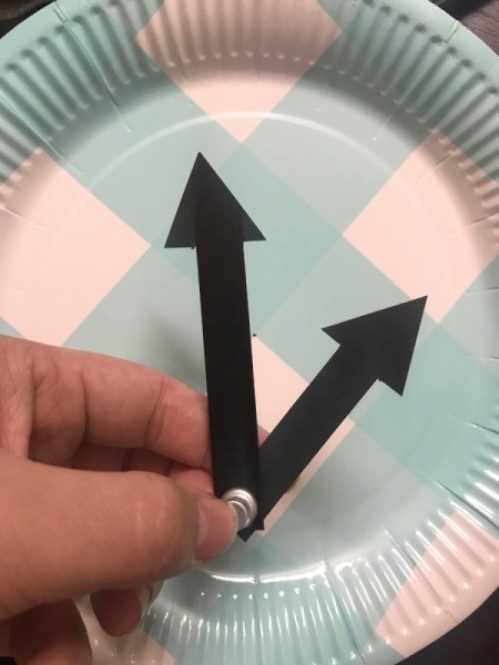 Paper Plate Clock - use the fastener to poke a hole in the two arrows